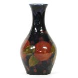 An early 20th century William Moorcroft Pomegranate vase, of inverted baluster form, signed and