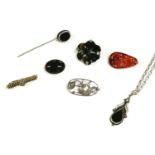 A collection of items to include a silver carved Chinese Cornelian brooch, a tapering oval Cornelian