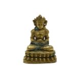 A late 19th century bronze Buddhistic figure, seated on a lotus flower, 10.5cm high