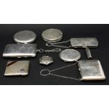 A collection of silver compacts to include a lipstick holder, and a silver hexagonal pendant compact