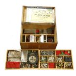 A collection of Meccano, in an oak box, with three trays, together with various instruction books