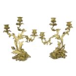 A pair of gilt bronze three branch candelabra, 33cm high