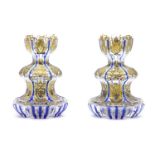 A pair of cut blue glass bottle vases, with gilt details, 14cm high