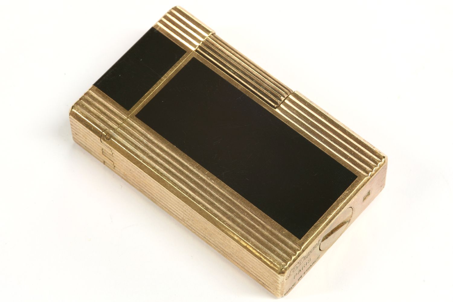 An S T Dupont gold plated lighter, set with Japanese black lacquer inlay, with printed oriental