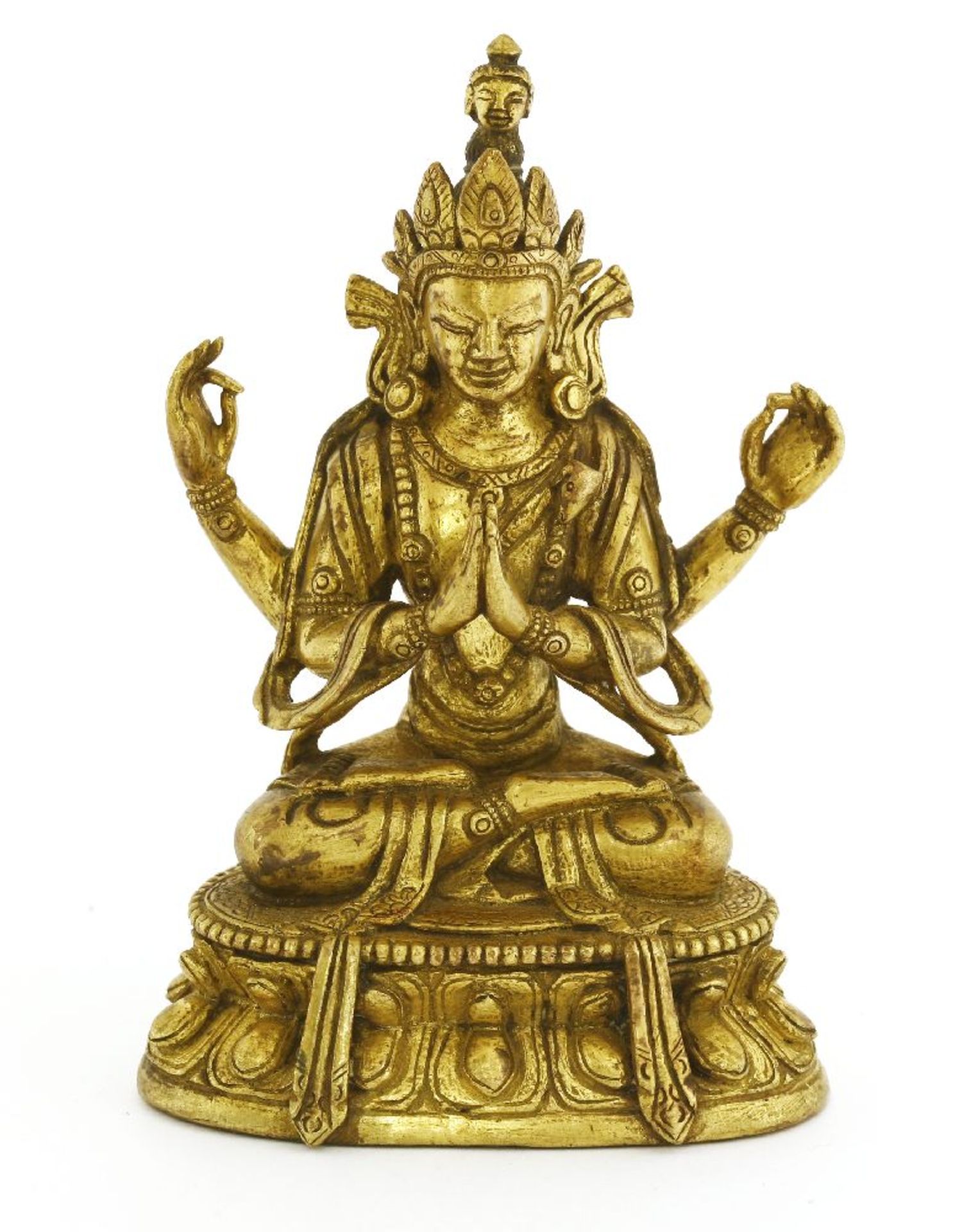A bronze bodhisattva, seated cross-legged on a lotus pedestal, 10cm high