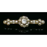 A cased late Victorian gold, diamond and split pearl bar brooch, c.1890,with an old European cut