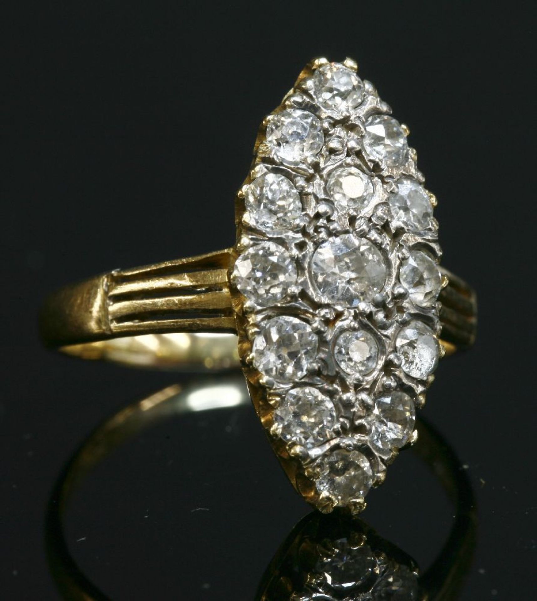 A late Victorian diamond set marquise cluster ring,with graduated old brilliant cut and one