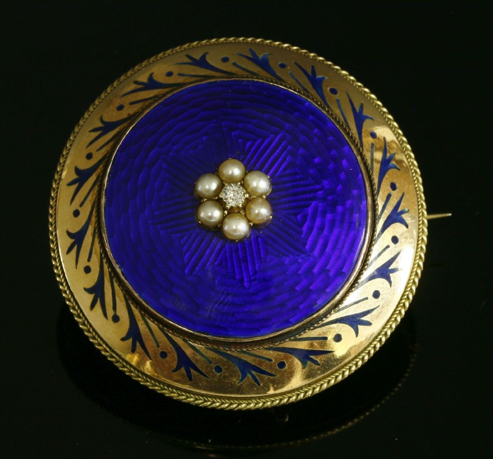 A Victorian diamond, split pearl and enamel, circular shield form brooch, c.1850,with a circular