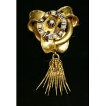 A Victorian gold, split pearl and enamel tassel brooch, c.1860, of looped ribbon form to a tubular