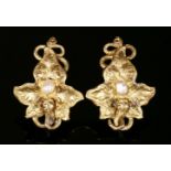 A pair of Continental gold, leaf and pearl earrings, with later screw fittings. A vine or ivy