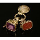 A William IV gold intaglio seal, c.1830-1840,with a cushion-shaped amethyst, intaglio engraved