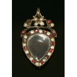 A Georgian gold and flat cut garnet, split pearl, glazed locket pendant, c.1790,a pear-shaped glazed