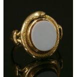 A gold sardonyx ouroboros ring,with a flat section open sardonyx tablet, rub set to a coiled snake