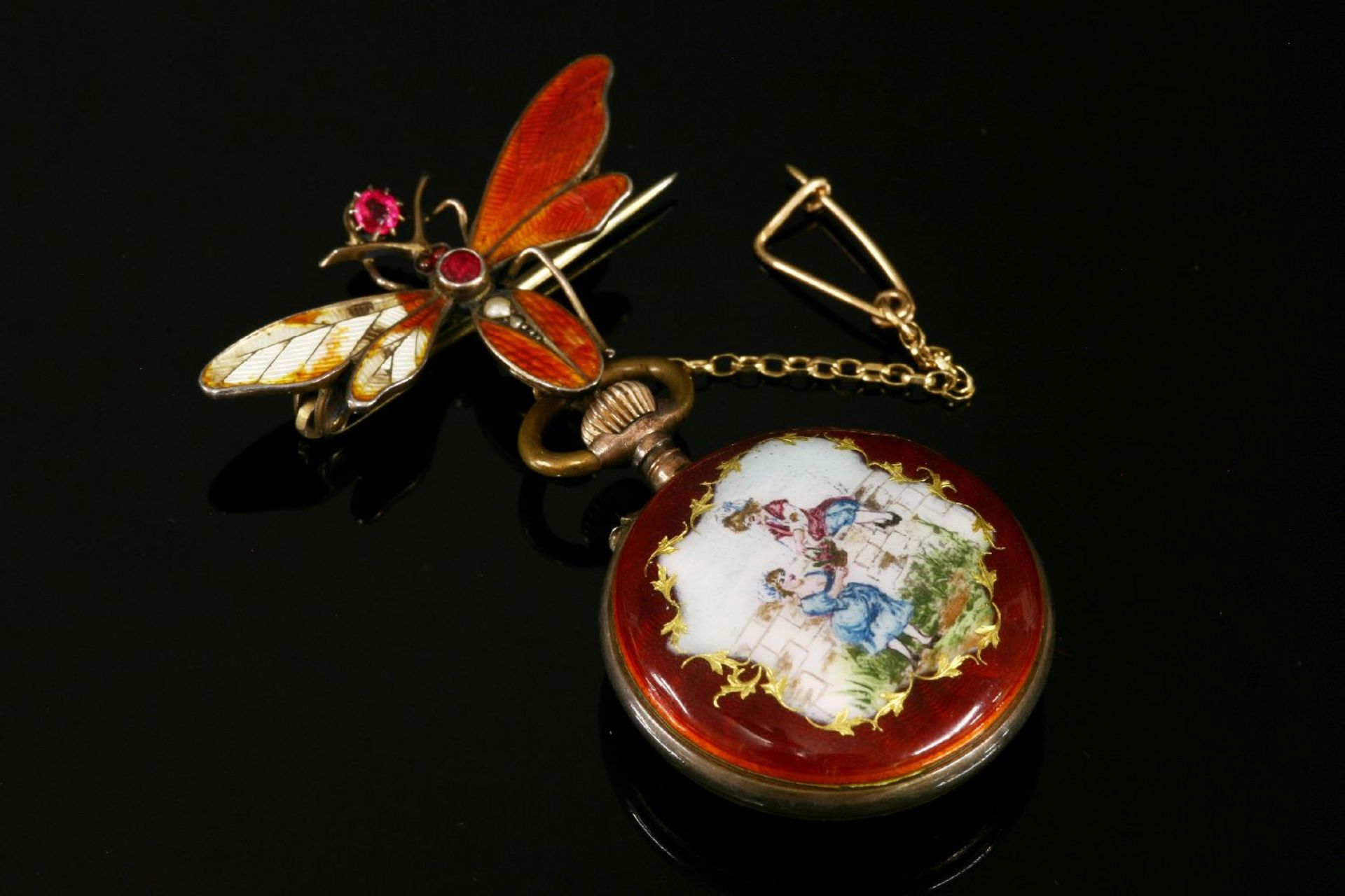 A Continental silver enamel fob watch,white enamel dial with Roman numerals, with gold hands. A