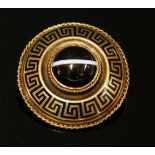 A late Victorian gold, banded agate and enamel memorial brooch of shield form,a circular cabochon