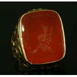 A gentlemen's intaglio engraved gold ring,with a cushion-shaped cornelian tablet, intaglio