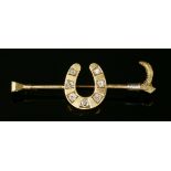 An Edwardian gold, diamond set horseshoe and crop stickpin, c.1910,a flat section horseshoe, grain