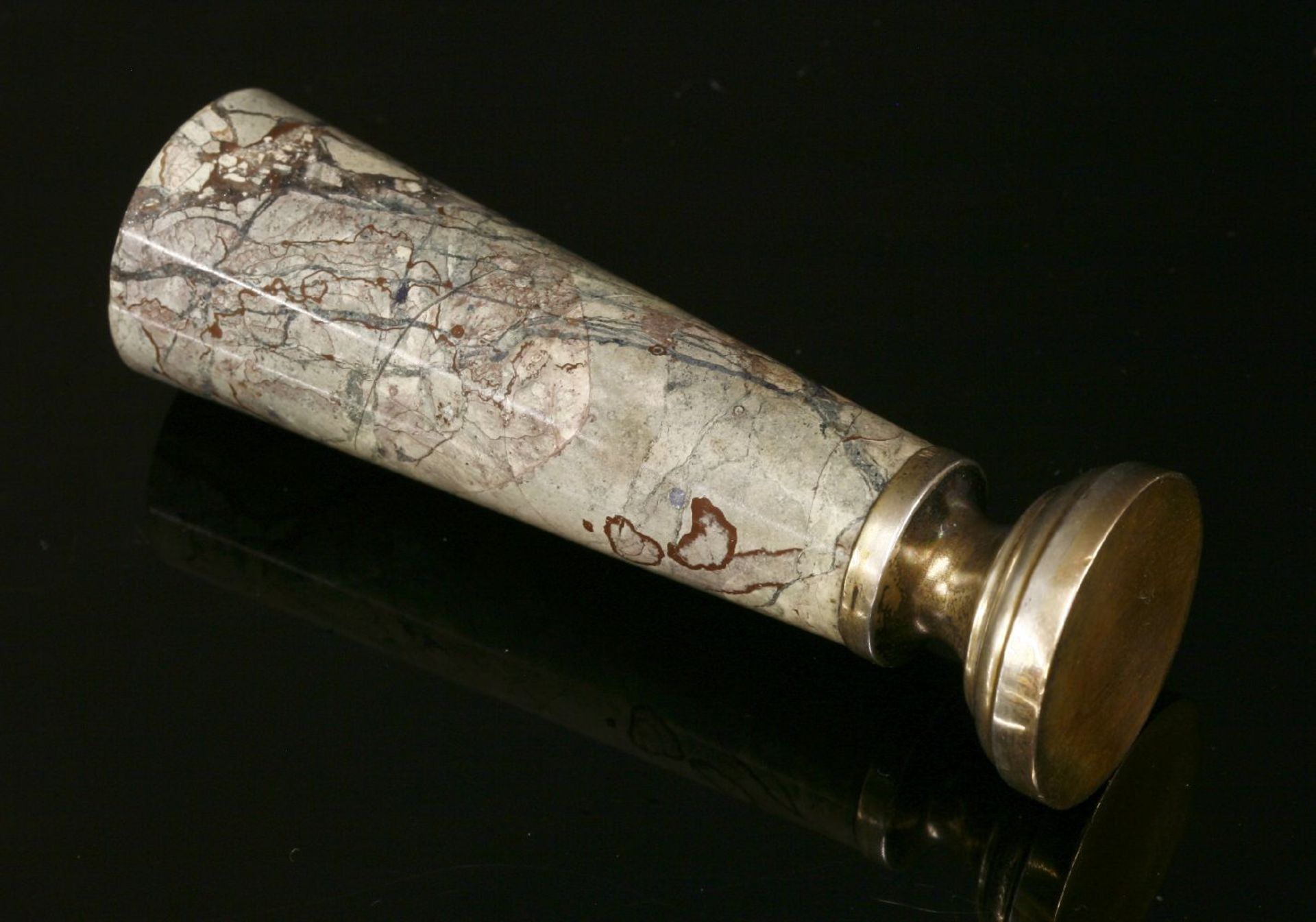 A Continental silver gilt hardstone desk seal,with a tapered cylindrical handle, with a blind base