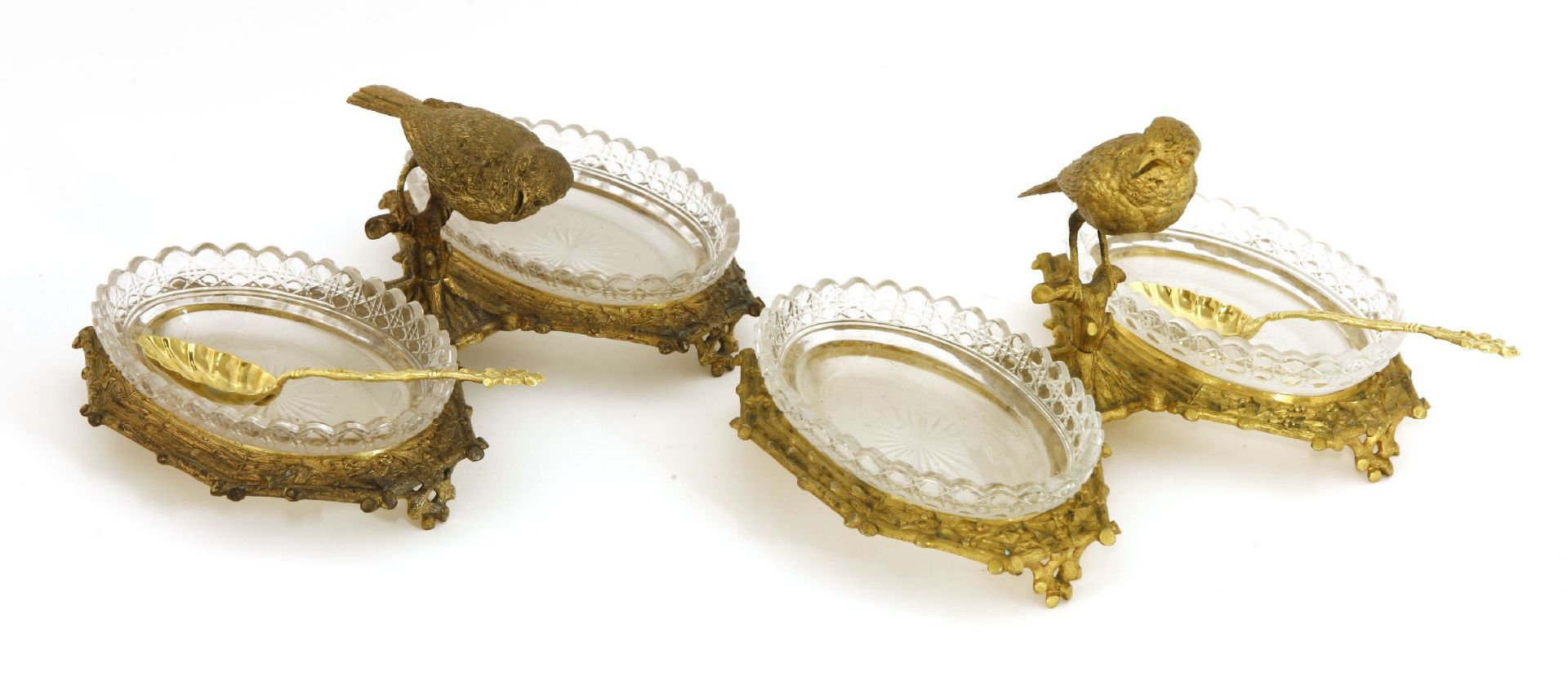 An unusual pair of gilt bronze and cut-glass two-division caviar dishes and spoons,c.1880, each