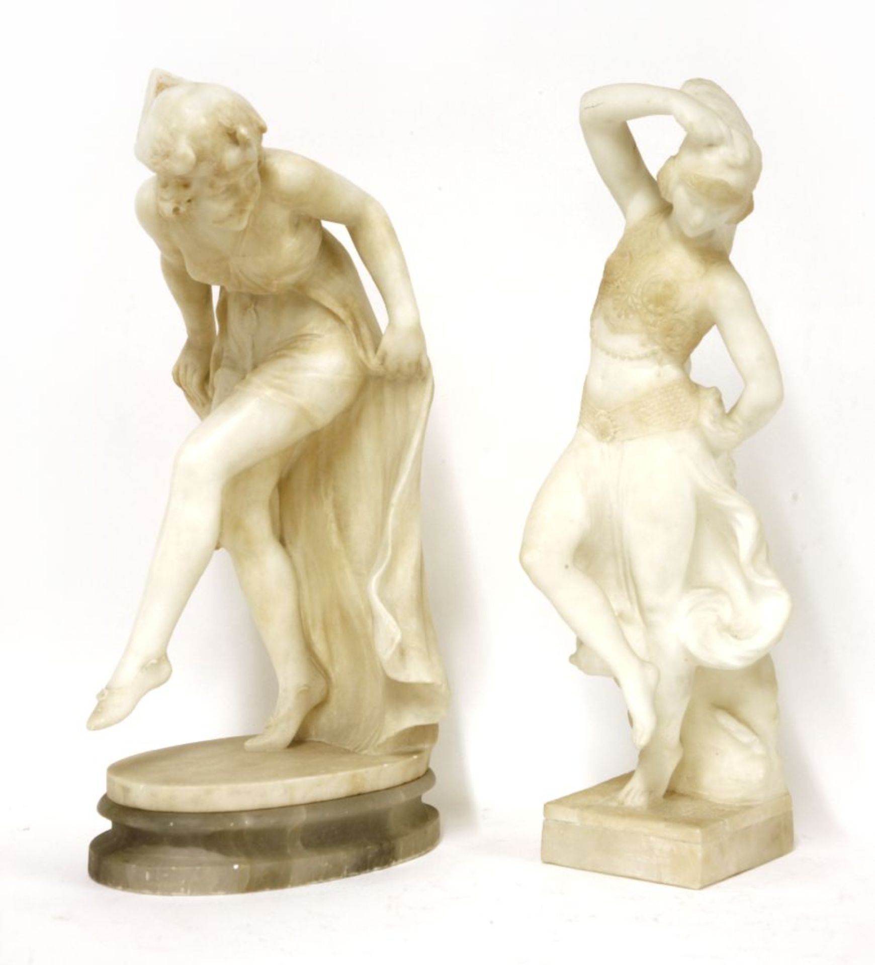 Two carved alabaster figures,c.1930, each in the form of an Art Deco dancer,47cm high (2)