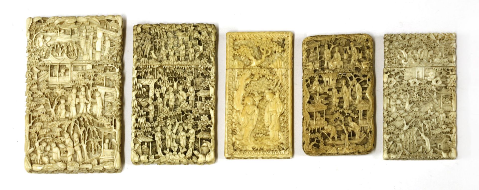 Five ivory cases,with figures in landscapes, buildings, trees and flowers,largest 10.75 x 6.5cm (5)