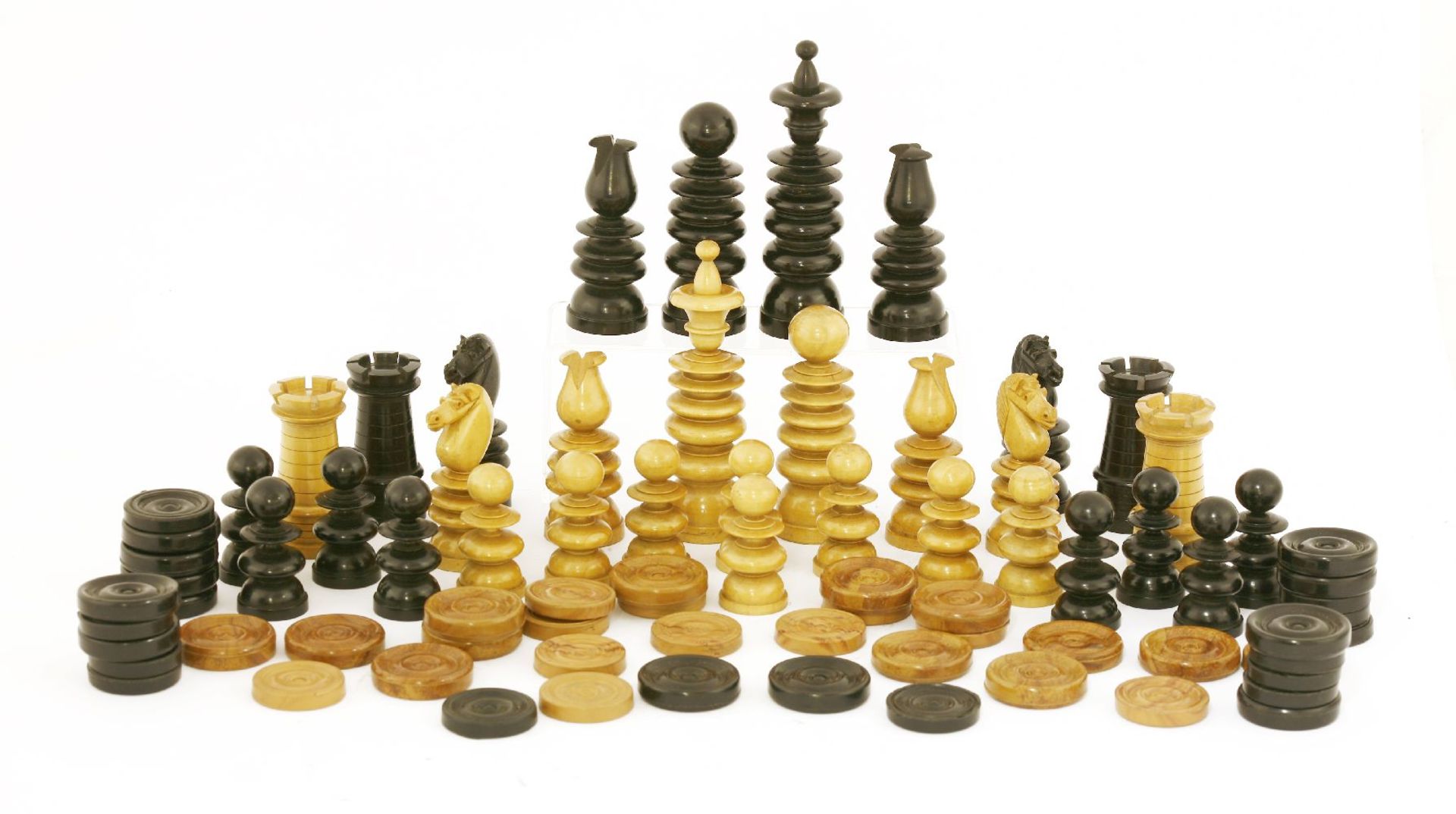 A boxwood and ebonised chess set,c.1920, of ring turned form, and in original box,the king 11.5cm