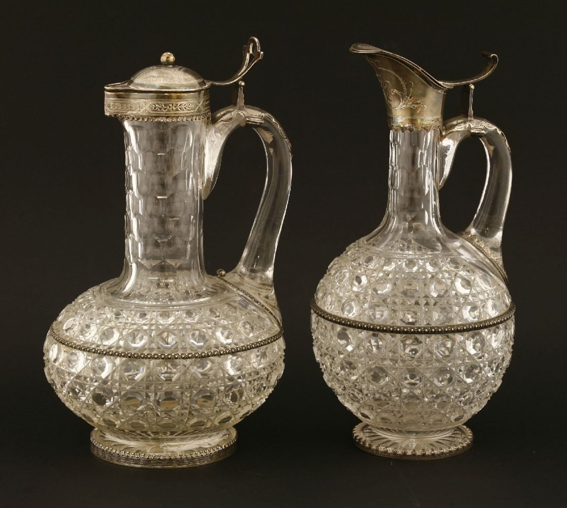 A near pair of mid-19th century German jug glass and silver-mounted claret jugs, the cut bodies of - Image 3 of 3