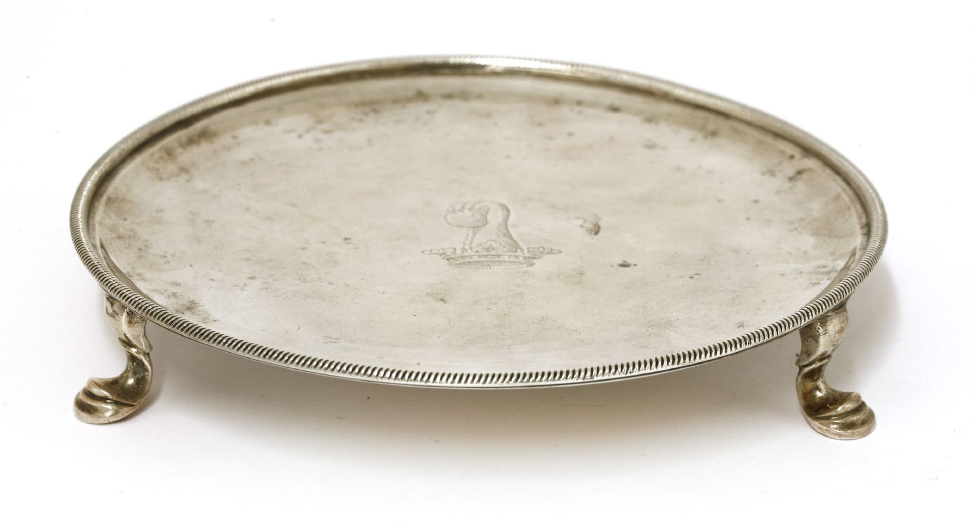 A George II silver card tray,by John Robinson II, London 1747, with an engraved crest within a