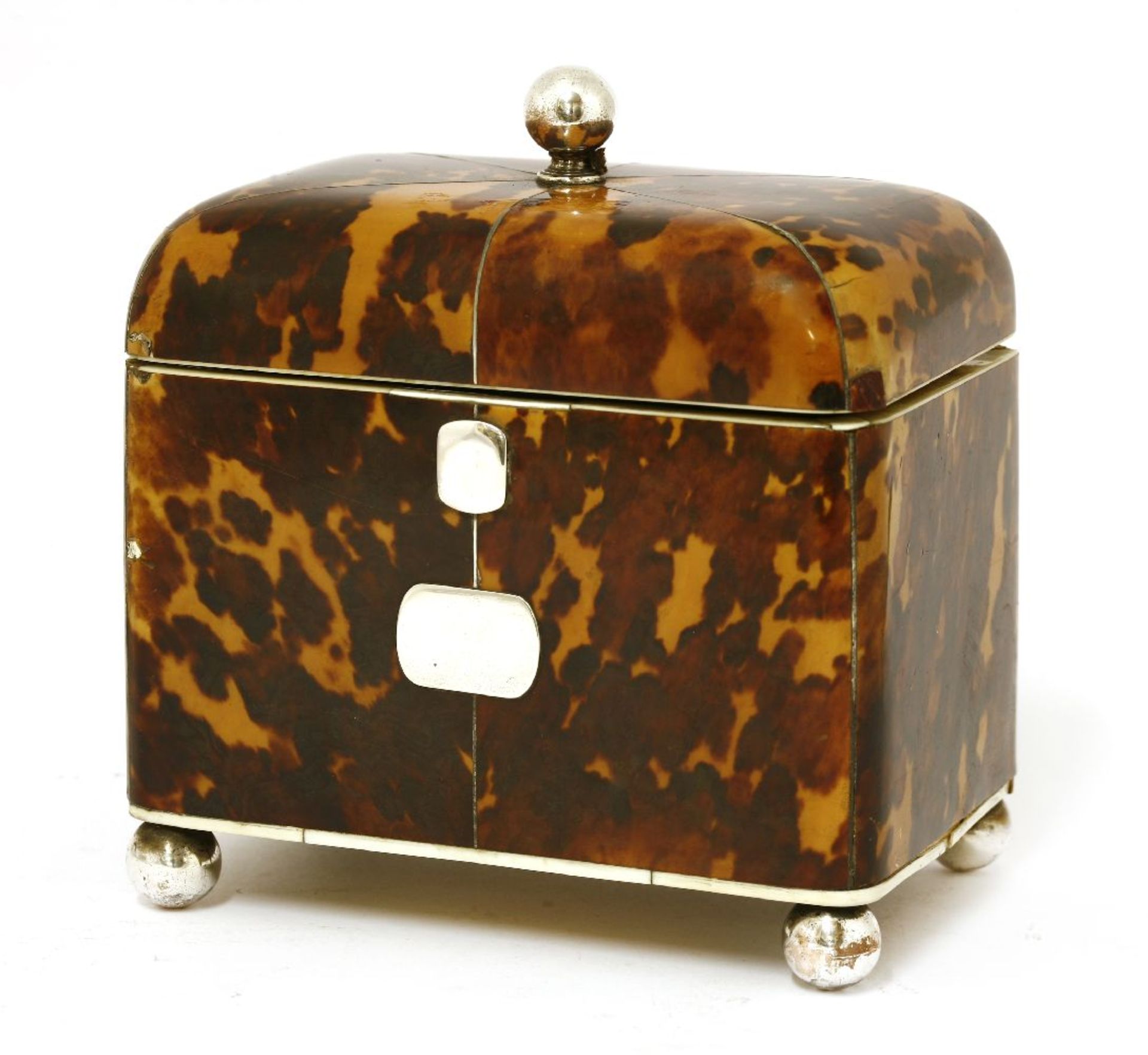 A tortoiseshell, ivory and white-metal-mounted tea caddy,early 19th century, with a ball finial over