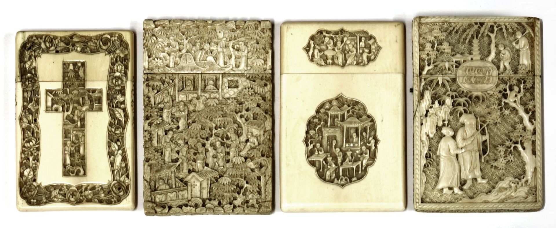 Four ivory cases,carved with figures in landscapes, pagodas, trees and foliage, one with crosses - Image 2 of 2