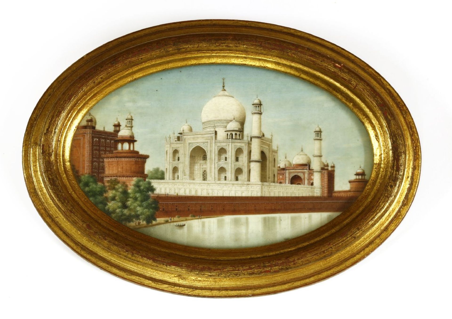 A large oval miniature on ivory,c.1860, of the Taj Mahal, seen from across the Yamuna river,13 x