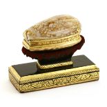 An 18th century unmarked gold-mounted snuff box,possibly English,together with a velvet and wood