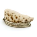 A mid-18th century unmarked silver-mounted cowrie shell snuff box,the rim edge engraved 'EIR 1769',