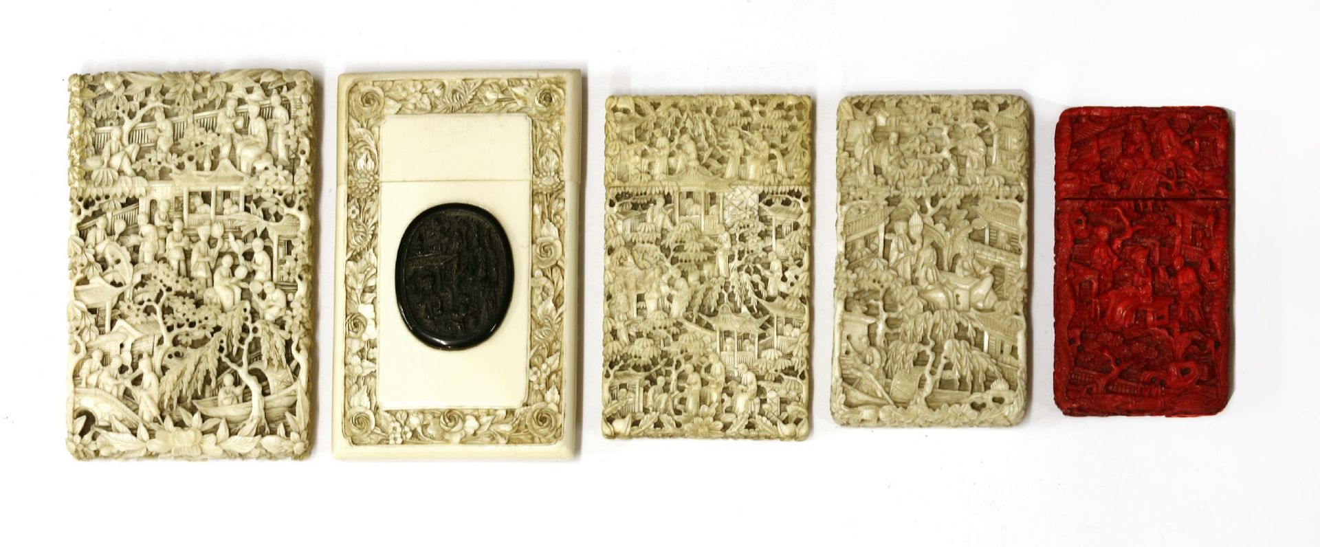 Five ivory cases, carved with figures in landscapes, trees, buildings and flowers, one red - Image 2 of 2