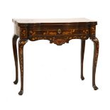 A Dutch marquetry games table,mid-18th century, the shaped inlaid top, decorated with an urn of