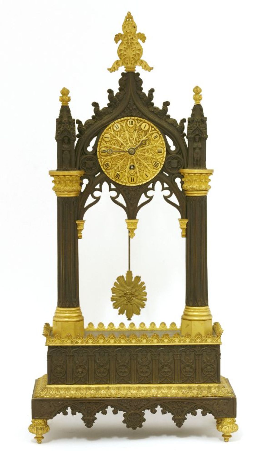 A Charles X gilt and patinated bronze 'Troubador' temple timepiece,with well-cast Gothic decoration,