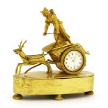 A Continental ormolu mantel clock,in the form of a huntress with a chariot pulled by a stag,19cm