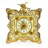 A Continental gilt metal strut-form clock,with a cherub surmount,27cm high