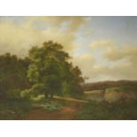 Attributed to Marinus Adrianus Koekkoek (Dutch, 1807-1868)A WOODED LANDSCAPE WITH FIGURES ON A