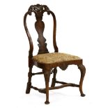 An 18th century-style walnut side chair,with vase-shaped splat drop-in seat, on stretchered cabriole