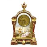 A Vienna porcelain clock,late 19th/early 20th century, the arching case with urn surmount over a
