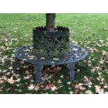 A cast iron tree seat, 20th century, with a pierced back and seat, 180cm diameter85cm high