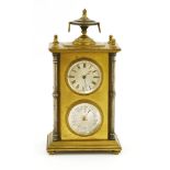 A gilt brass and silvered timepiece/barometer,late 19th century, with an urn finial over a