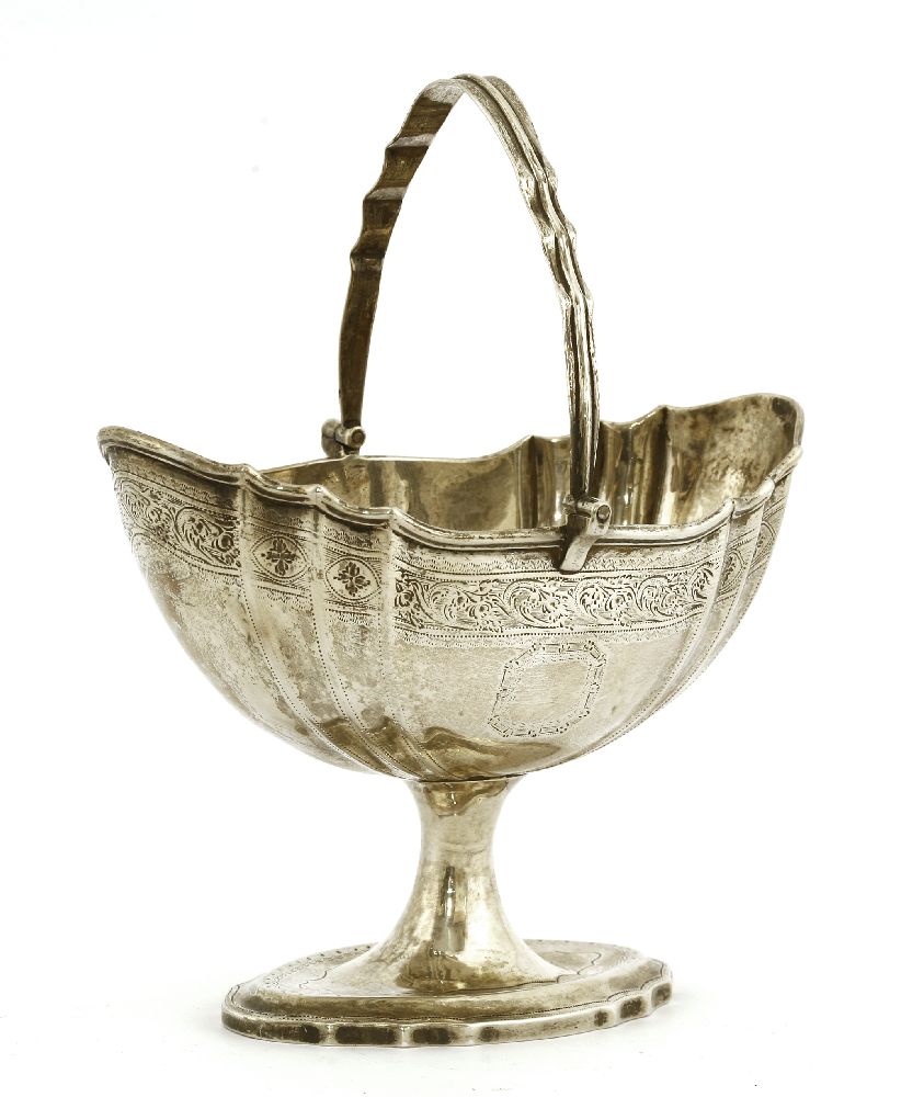 An Irish silver basket,maker's mark RS, Dublin, 1802,of stamped oval form, with a swing handle, - Image 2 of 3