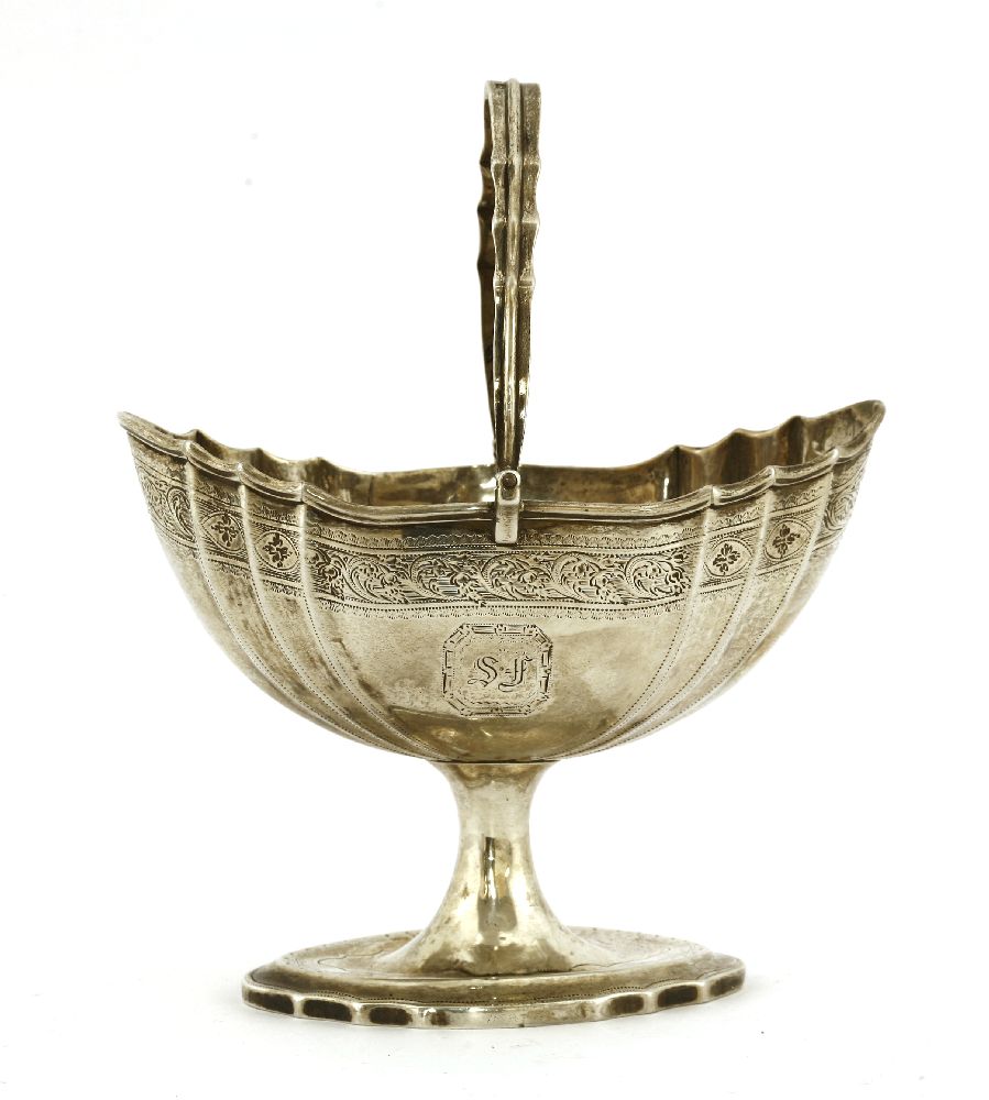 An Irish silver basket,maker's mark RS, Dublin, 1802,of stamped oval form, with a swing handle,