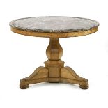 A French Empire oak centre table,c.1815, the circular top with a moulded marble inset, an