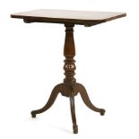A mahogany tilt-top table,early 19th century, possibly Irish, the rectangular rosewood crossbanded