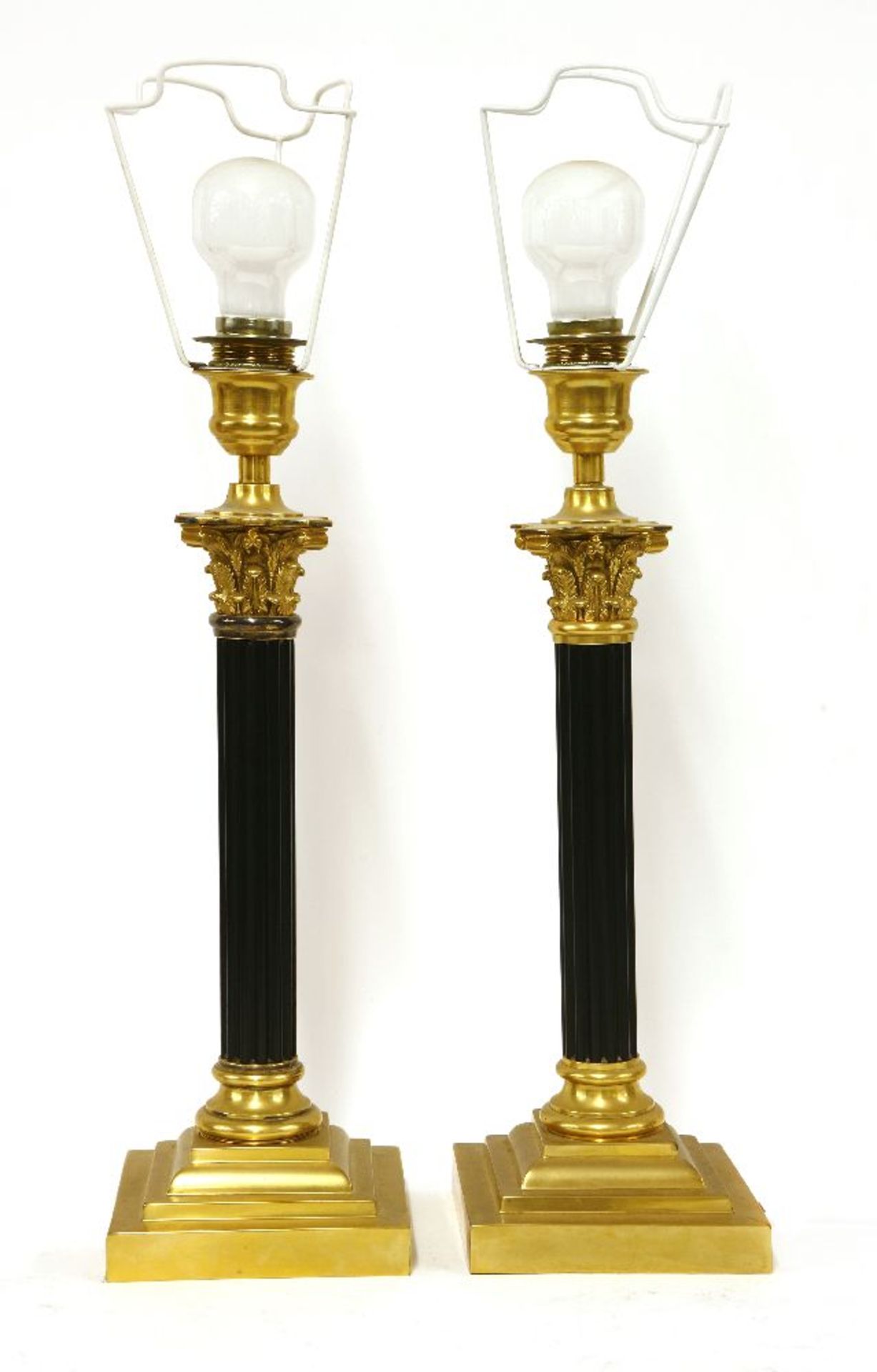 A pair of Corinthian column table lamps,with gilt capitals and on square stepped bases, stamped '