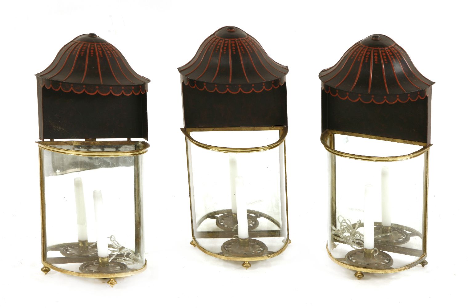 Three gilt metal wall lights,20th century, of demilune shape with mirrored backs and painted metal