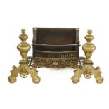 A large George III-style brass and cast iron fire basket, early 20th century, with outstepped turned